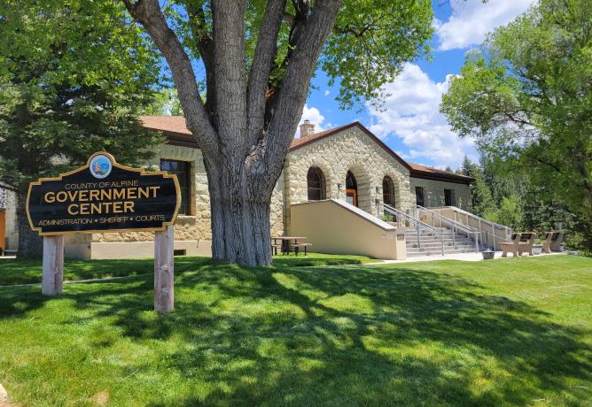 Entrance to the Alpine County Courthouse on a sunny day. 